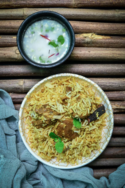 istock Delicious mutton biryani top view.Biryani rice dish Beautiful Indian rice dish.Delicious spicy chicken biryani in bowl over moody background, it’s a popular Indian and Pakistani food. 1398046309