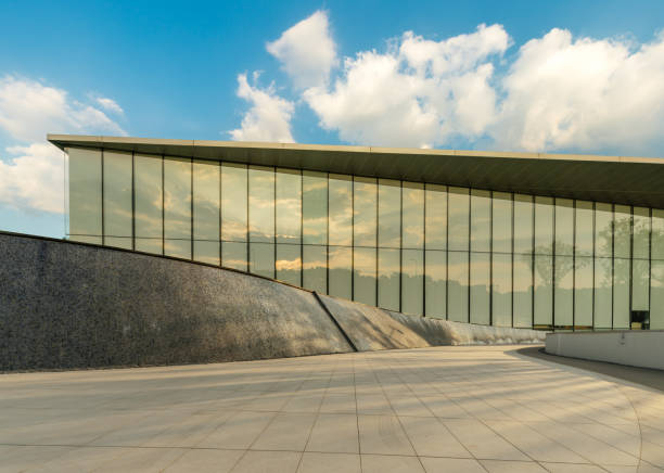 istock empty footpath in front of modern building during sunrise. 1398047233
