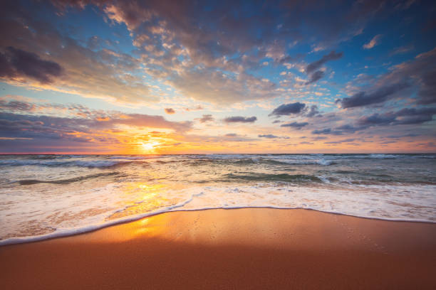 istock Beach sunrise over the tropical sea sand 1398048143