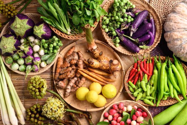 Organic Southeast Asian vegetables and spices from local farmer market in Thailand Organic Southeast Asian vegetables and spices from local farmer market in Thailand, Sustainability concept, Table top view thai food stock pictures, royalty-free photos & images