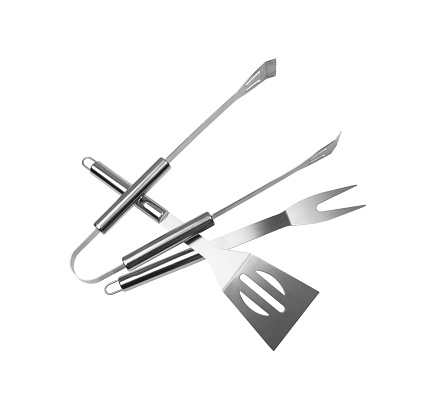 Grilling tools set isolated. BBQ metal equipment, steel barbecue fork, tong, spatula on white background