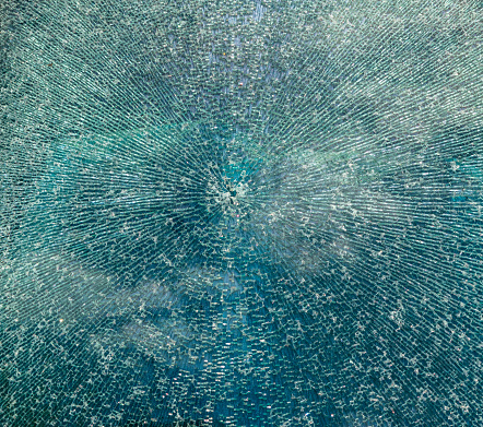Cracked glass texture background. Broken tempered glass with cracks, shattered window pattern, chapped transparent surface wallpaper, safety shards mockup