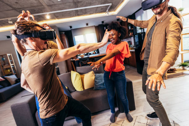 istock Cheerful friends having fun with VR in home interior 1398051596