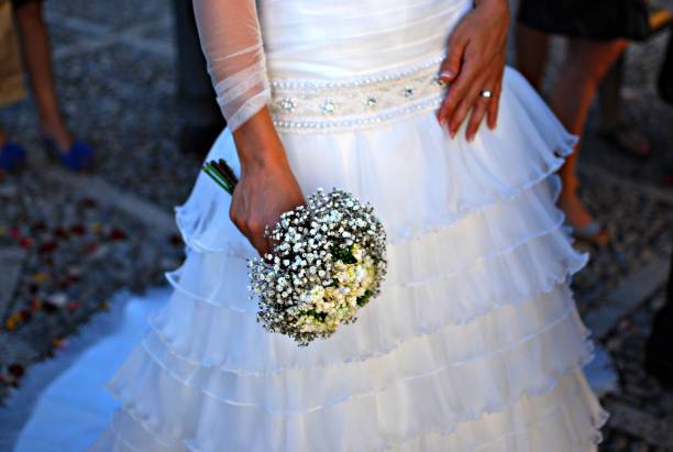 istock Woman dressed as a bride holding the bouquet 1398053279
