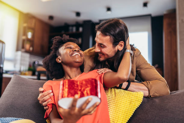 istock Man giving gift to his girlfriend. 1398056406