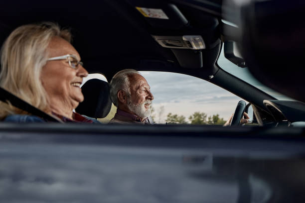 istock Happy senior couple going on a trip by car. 1398056975