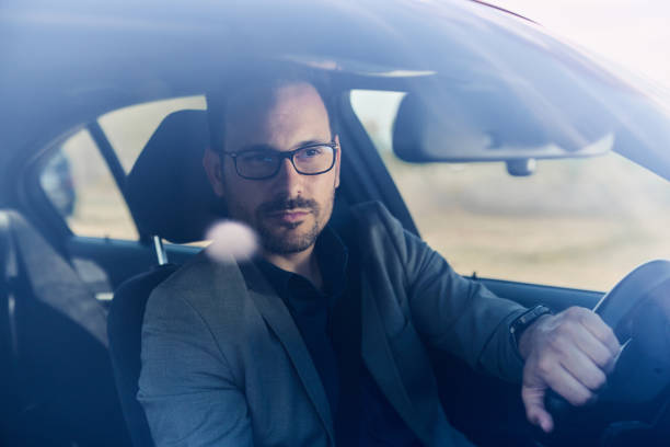 istock Young male entrepreneur going on a trip by car. 1398057023