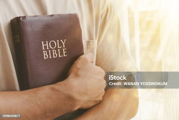 Christian Life Faith Hope Trust In God Stock Photo - Download Image Now - Bible, Embracing, Men