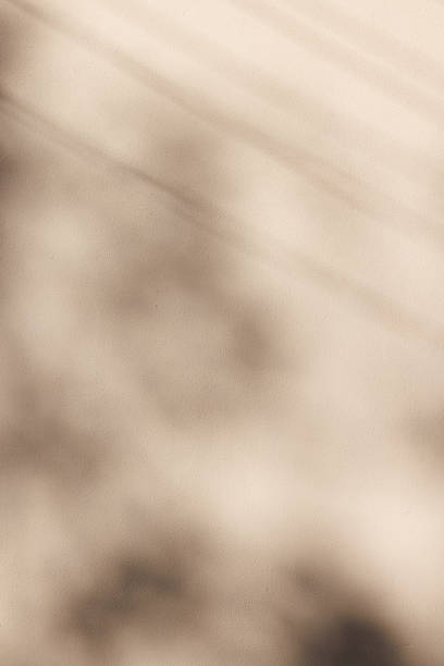 istock Part of a beige concrete wall with shadows 1398061163