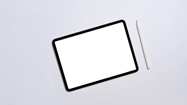 istock Flat lay digital tablet with empty display and stylus pen on white background. 1398063726