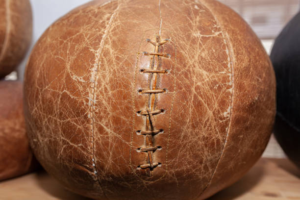 istock Old brown leather medicine ball, weathered and worn 1398064112