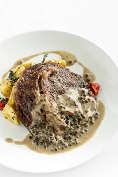 istock rib eye steak with creamy peppercorn sauce 1398065074
