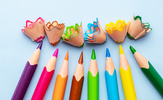 pencil shaving flowers and sharp pencils, different colors, smile shape arrangement, ready for art shop, creative, waste from sharpening. funny activities, kindergarten. back to school