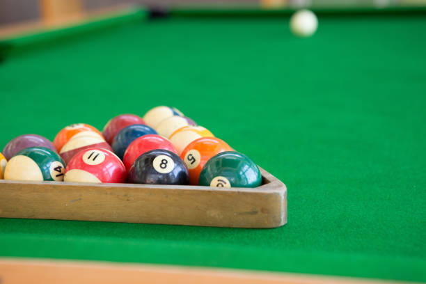 istock Selective focus of Colorful pool balls on green pool table 1398070643