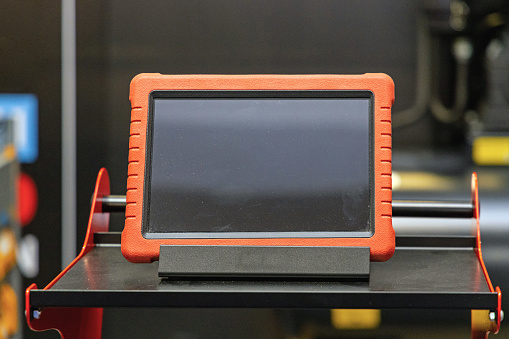 Electronic Diagnostic Tablet Device at Cart in Service Garage