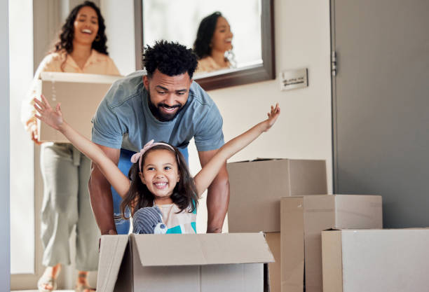 Shot of a young father having fun with his daughter at home stock photo