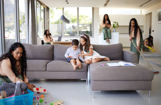 istock Shot of a young mother doing different tasks around the house 1398076703