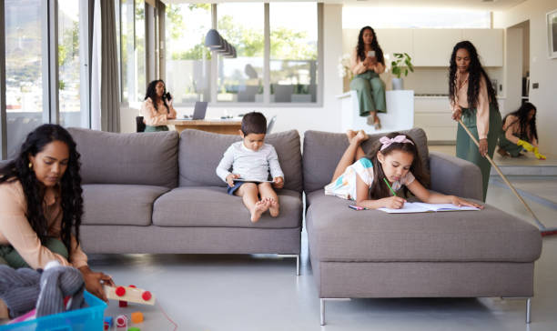 istock Shot of a young mother doing different tasks around the house 1398076710