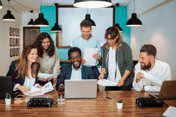 istock Group of multiethnic colleagues working on laptop 1398076800