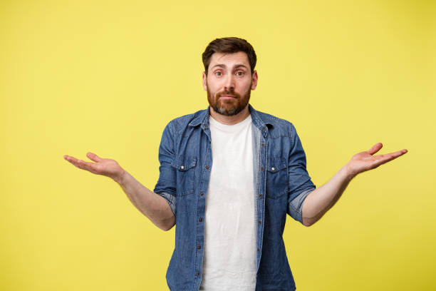 istock Confused Guy throws up his hands in a misunderstanding of what is happening 1398077020