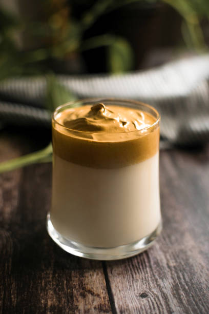 istock glass of dalgona coffee on dark wooden table 1398077143