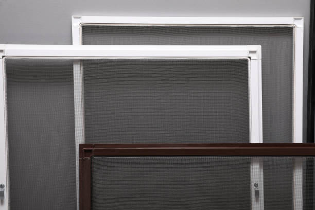 istock Mosquito window screens near grey wall, closeup 1398080147