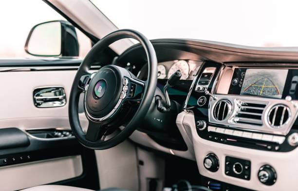 Rolls Royce Ghost Seattle, WA, USA
October 5, 2021
Interior of a Rolls Royce Ghost with white interior showing the steering wheel, driver door card and center console. rolls royce stock pictures, royalty-free photos & images