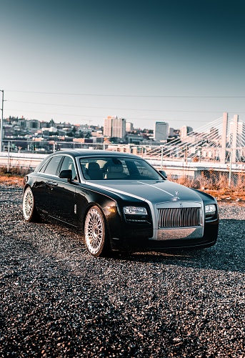 Seattle, WA, USA\nOctober 5, 2021\nBlack and silver two-tone Rolls Royce Ghost parked in a Seattle parking lot.