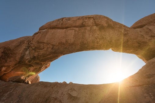The arch at Spitzkoppe is also known as Eye of Namibia. The famous natural rock bridge arch at Spitzkoppe in the Erongo Region, Namibia, Africa