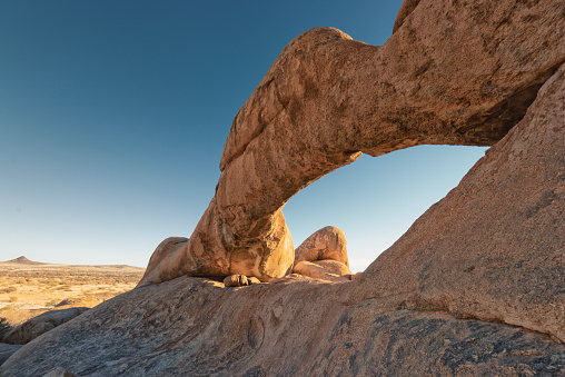 The arch at Spitzkoppe is also known as Eye of Namibia. The famous natural rock bridge arch at Spitzkoppe in the Erongo Region, Namibia, Africa