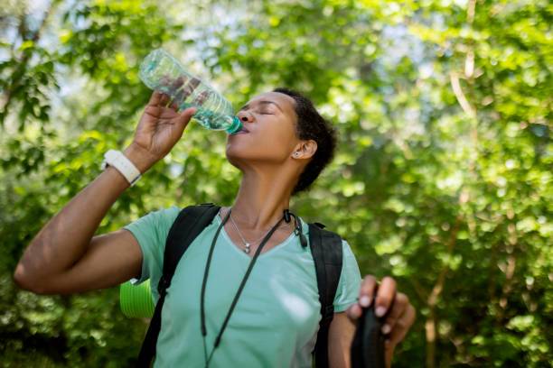 istock Tired Hiker Woman In Forest Hydrating 1398089251