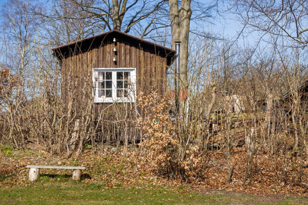 Shed in a allotment garden on a clear day of early spring. The allotment gardens in a Danish invention and is very popular. This one is from Humlebæk which is a suburb to Copenhagen