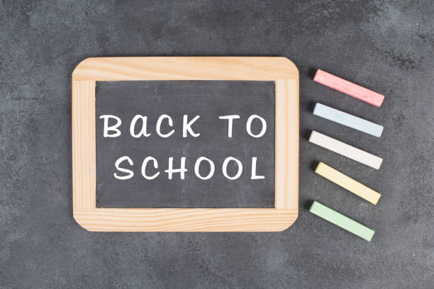 istock Chalkboard with the text back to school, education concept, colorful chalk 1398092164