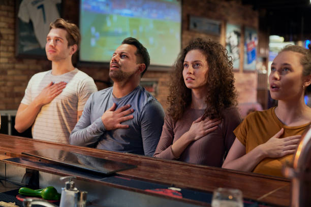 istock Happy Friends Watching Soccer Match At Bar 1398093099