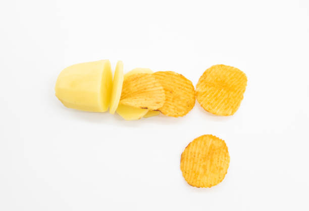 istock Potato slices with chips isolated on white background, selective focus 1398095717