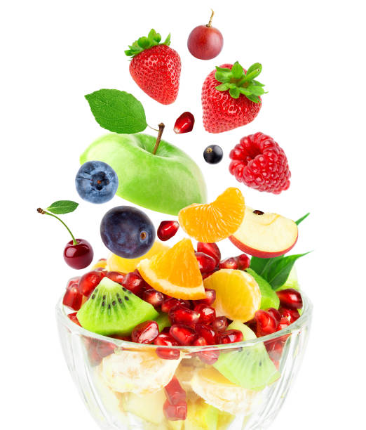 istock Mixed fruits on white background. Fruit salad. Falling fruits. 1398095762