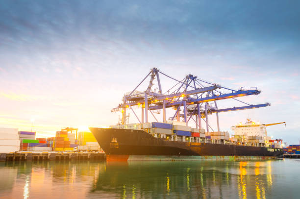 istock Containers loaded by crane in the trading port 1398097434