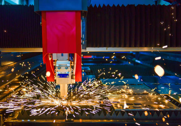 istock Industrial laser cut machine while cutting the sheet metal with the sparking light. 1398103585