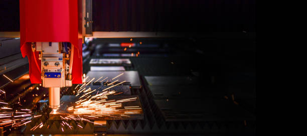 istock Industrial laser cut machine while cutting the sheet metal with the sparking light. 1398103813