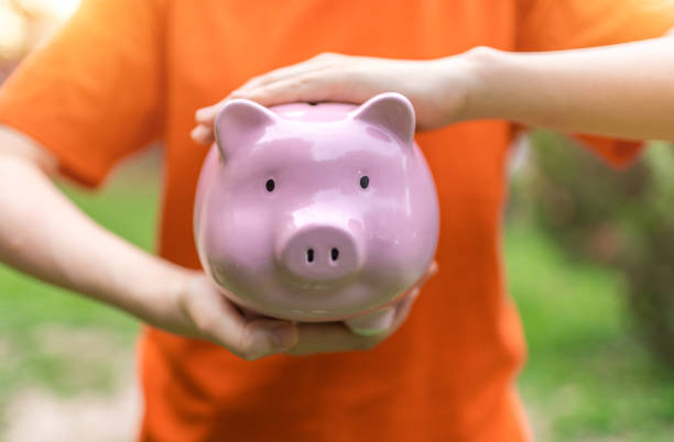 Holding Piggy Bank