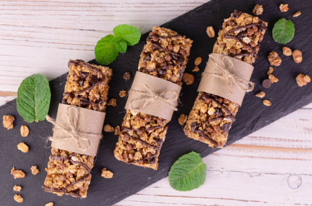 istock Granola bars on a black board.Healthy dessert appetizer.Flet ley. 1398105012