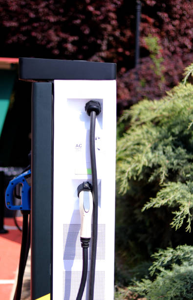 istock Electric car charger in a service area 1398105139