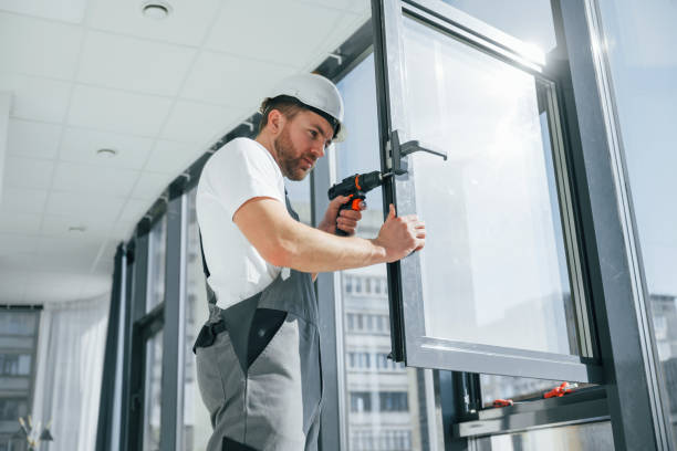 istock Using the drill. Repairman is working indoors in the modern room 1398107813