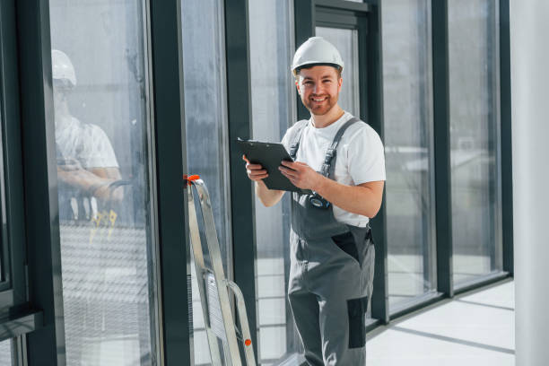 istock With notepad. Repairman is working indoors in the modern room 1398107942