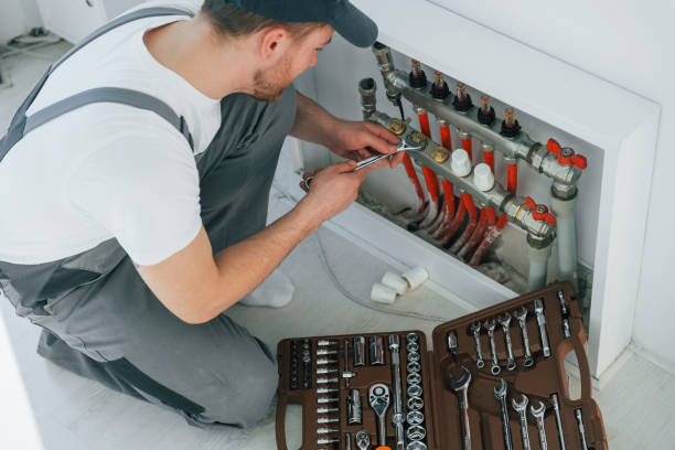 istock With special tools. Repairman is working indoors in the modern room 1398108099