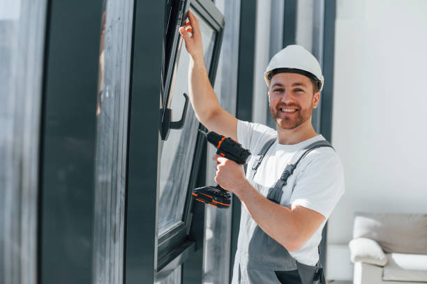 istock Using drill by installing windows. Repairman is working indoors in the modern room 1398108730