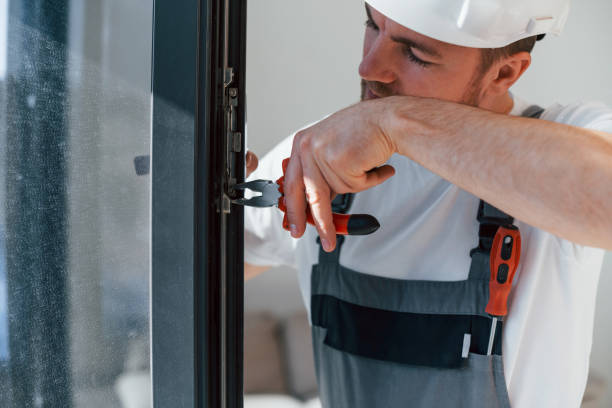 istock Using tool on the windows. Repairman is working indoors in the modern room 1398108747
