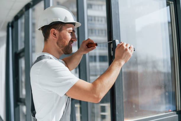 istock Using tool on the windows. Repairman is working indoors in the modern room 1398108752