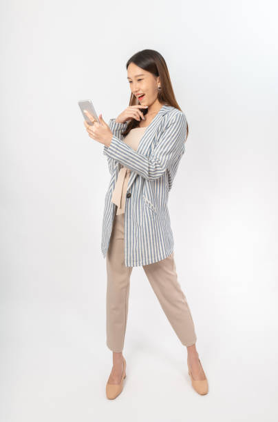 istock Young asian office lady with a phone 1398109102