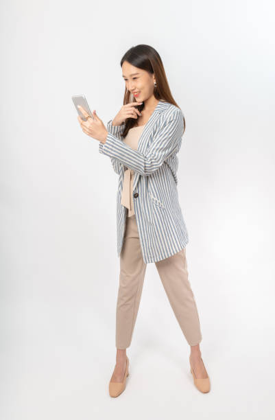 istock Young asian office lady with a phone 1398109135
